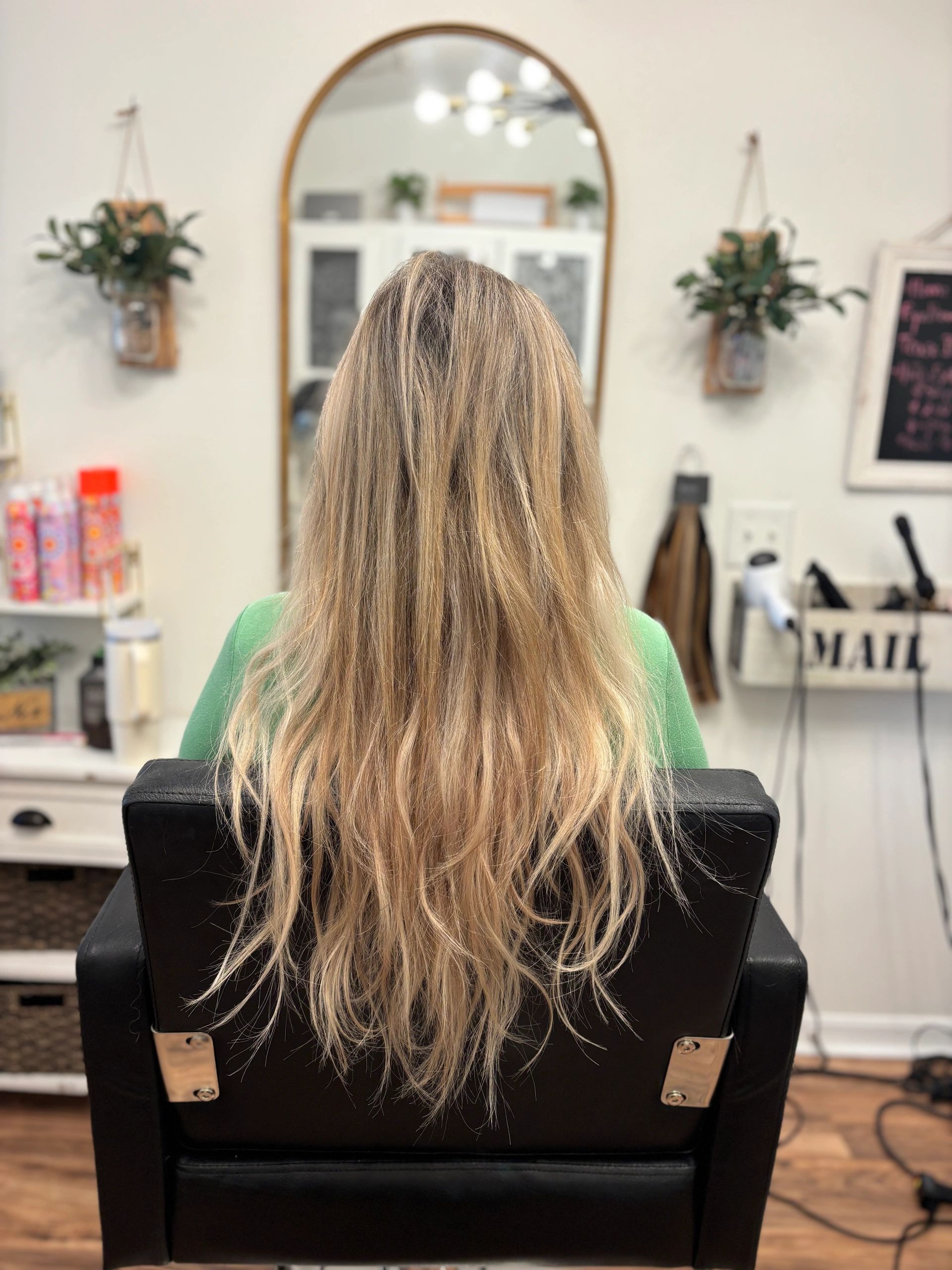 Layered blonde hair in salon chair
