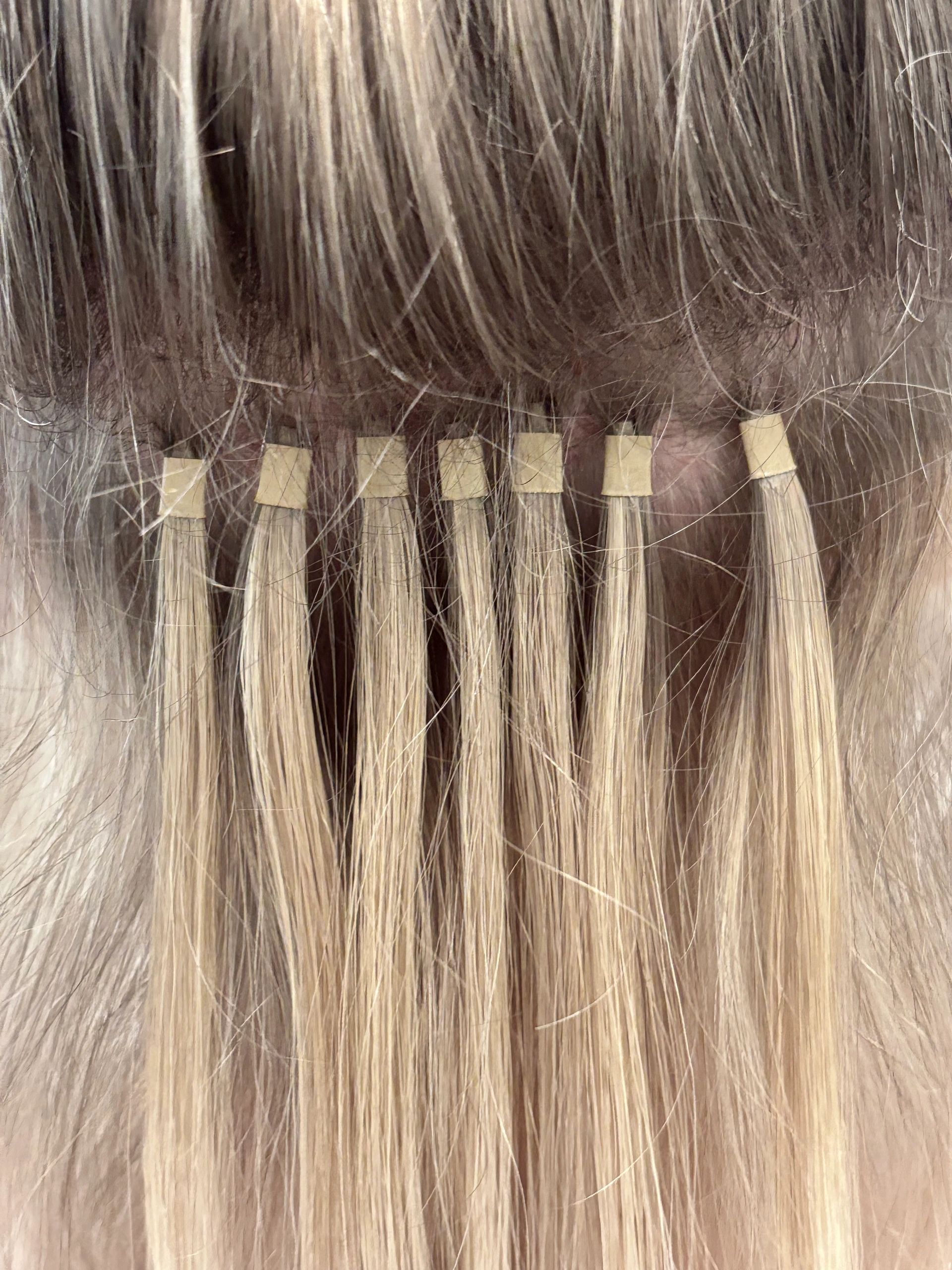 Hair extension color swatches — dark to light blonde